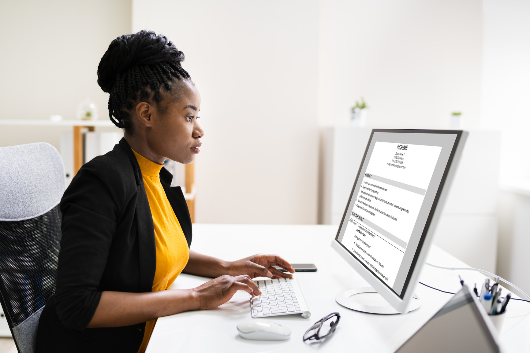 African Business Manager Reading Resume